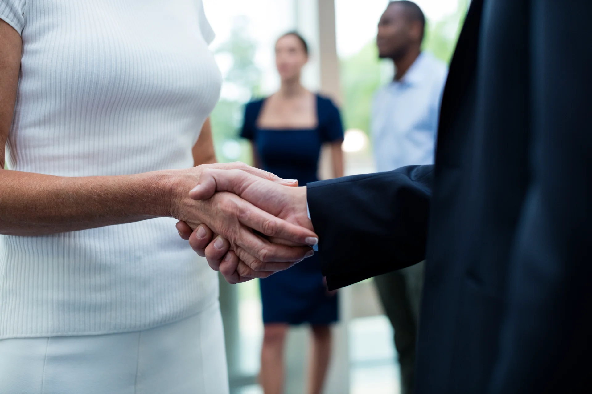 business handshake agreement between people in cor 2026 01 09 09 24 20 utc